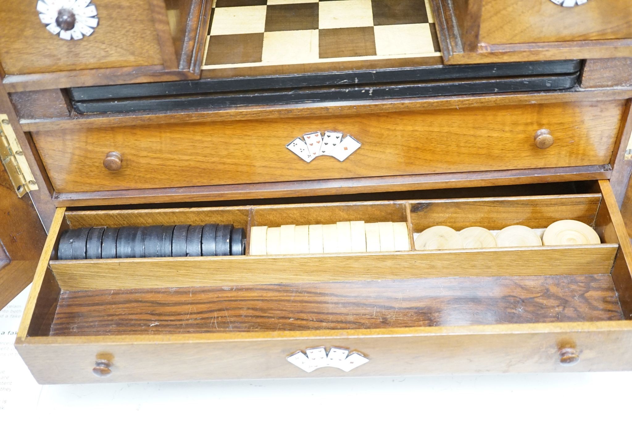 A late 19th century gilt metal mounted walnut games cabinet, W.40cm D.19cm H.49cm